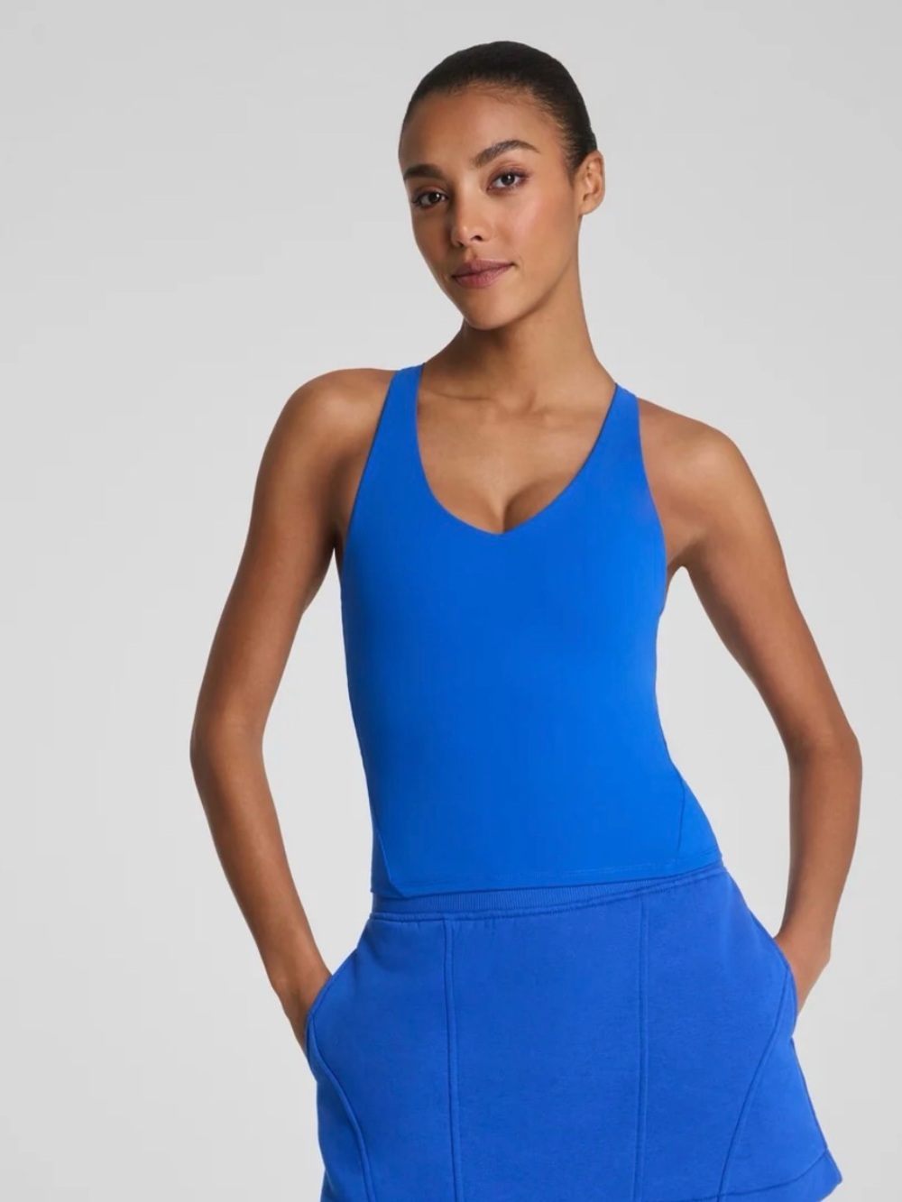 SPANX Boost-Up V-Neck Shelf Tank in blue current. Size Large